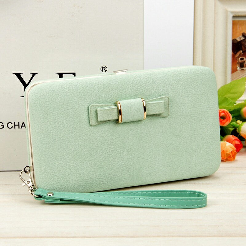 Factory spot low price wholesale new Korean version of women's wallet in the long money bag butterfly knot lunch box woman bag tide