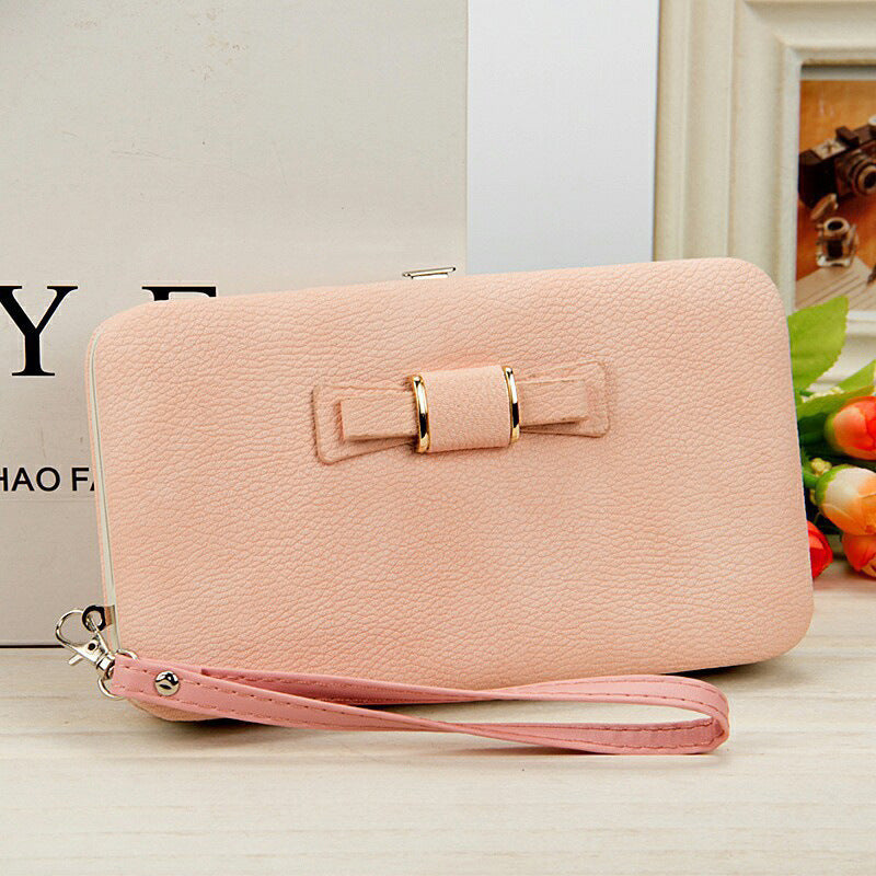 Factory spot low price wholesale new Korean version of women's wallet in the long money bag butterfly knot lunch box woman bag tide